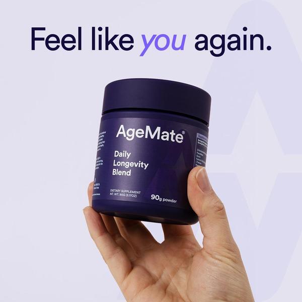 A close-up shot of a hand holding a jar of Daily Longevity Blend against a clean, light purple background.